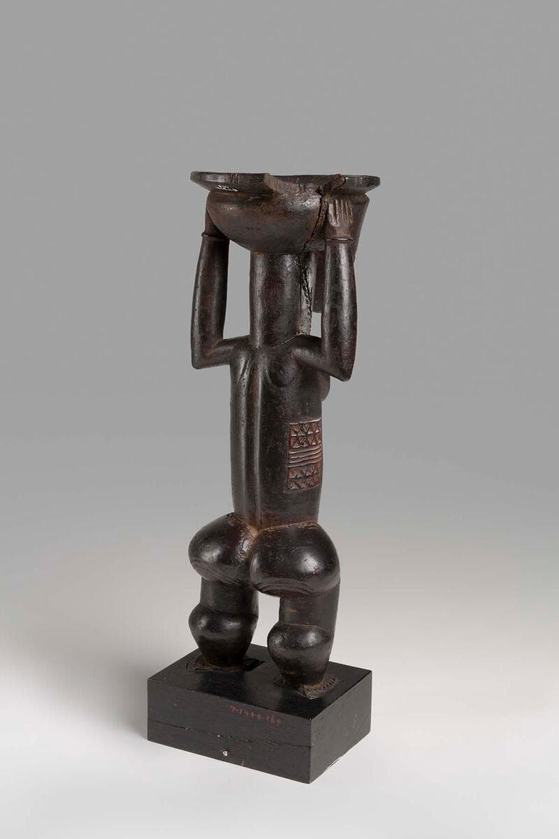 Standing Figure with Bowl on Head