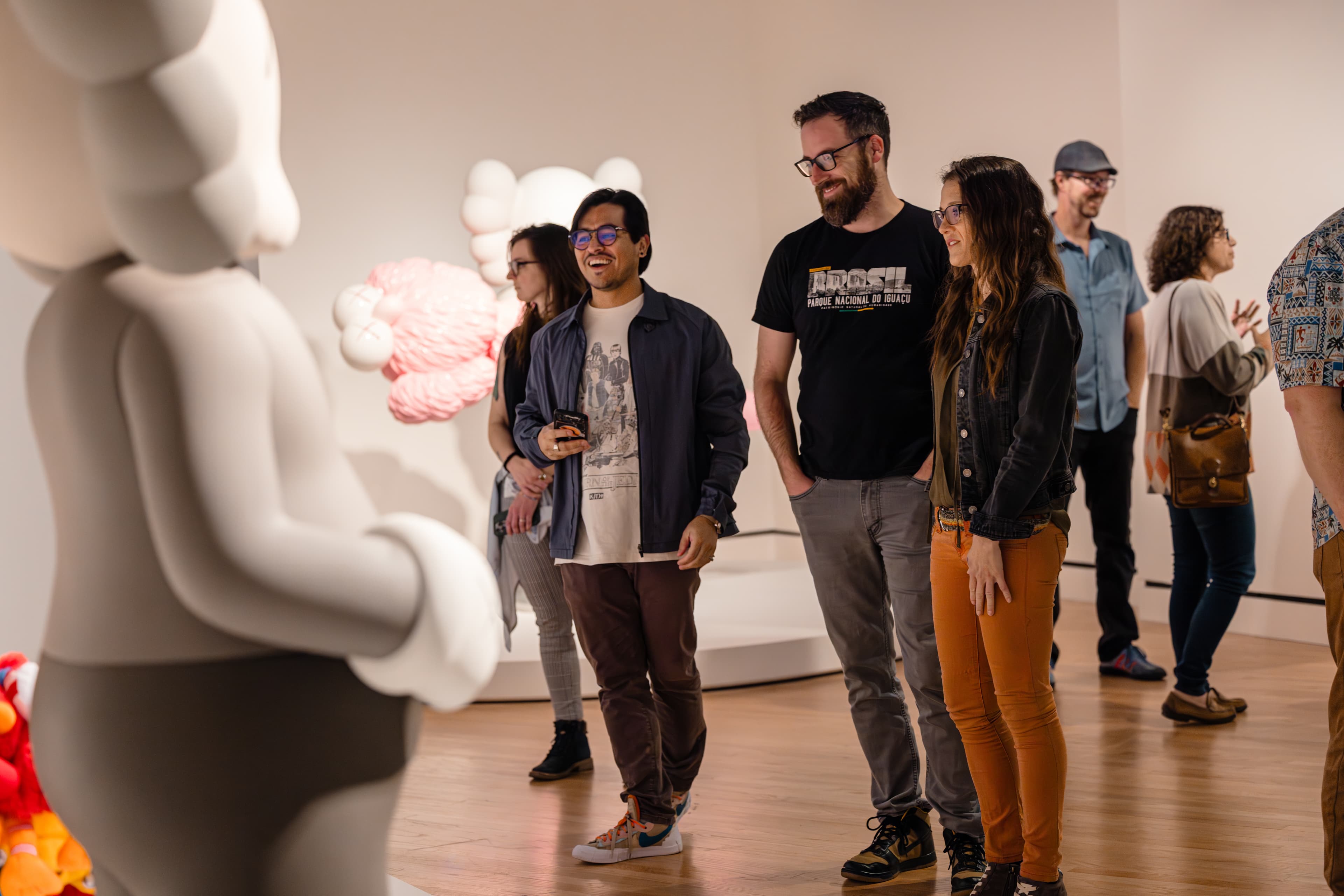 Family viewing a KAWS sculpture at Crystal Bridges