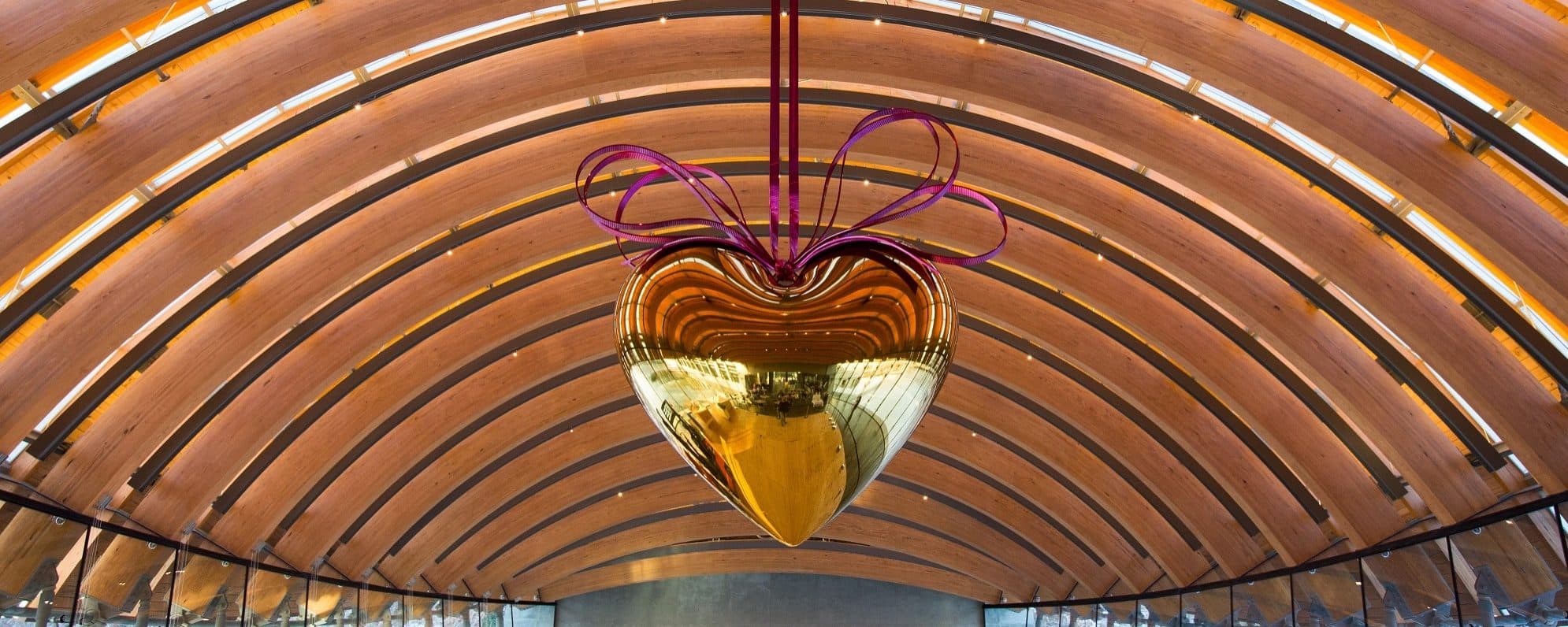 Jeff Koons, Hanging Heart (Gold/Magenta) from the series Celebration, 1994-2006, high-chromium stainless steel with transparent color coating and yellow brass, 114 5/8 × 110 1/4 × 40 in. (291.1 × 280 × 101.6 cm). Crystal Bridges Museum of American Art, Bentonville, Arkansas, 2013.31
