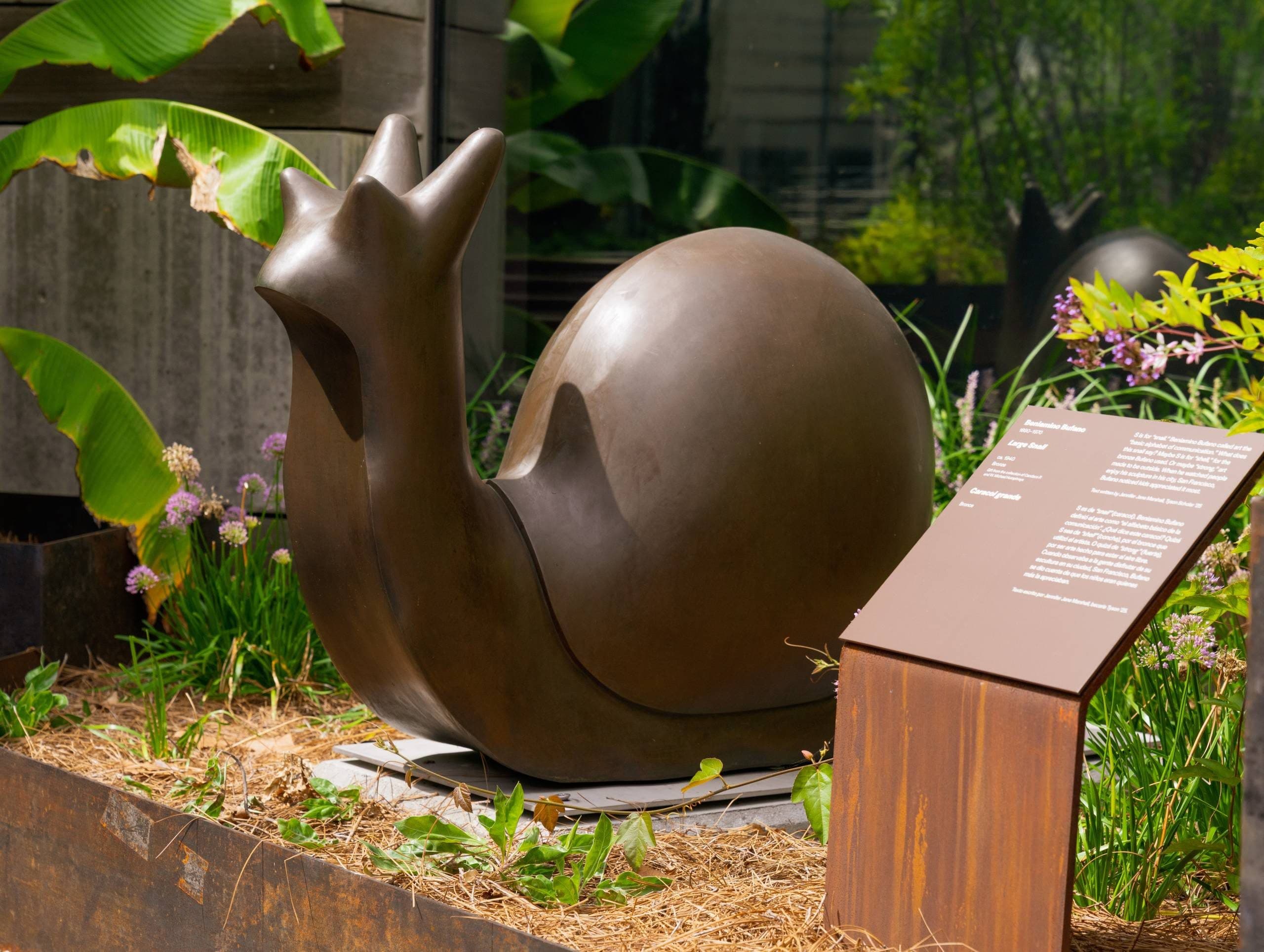 Bronze Snail Sculpture in Garden
